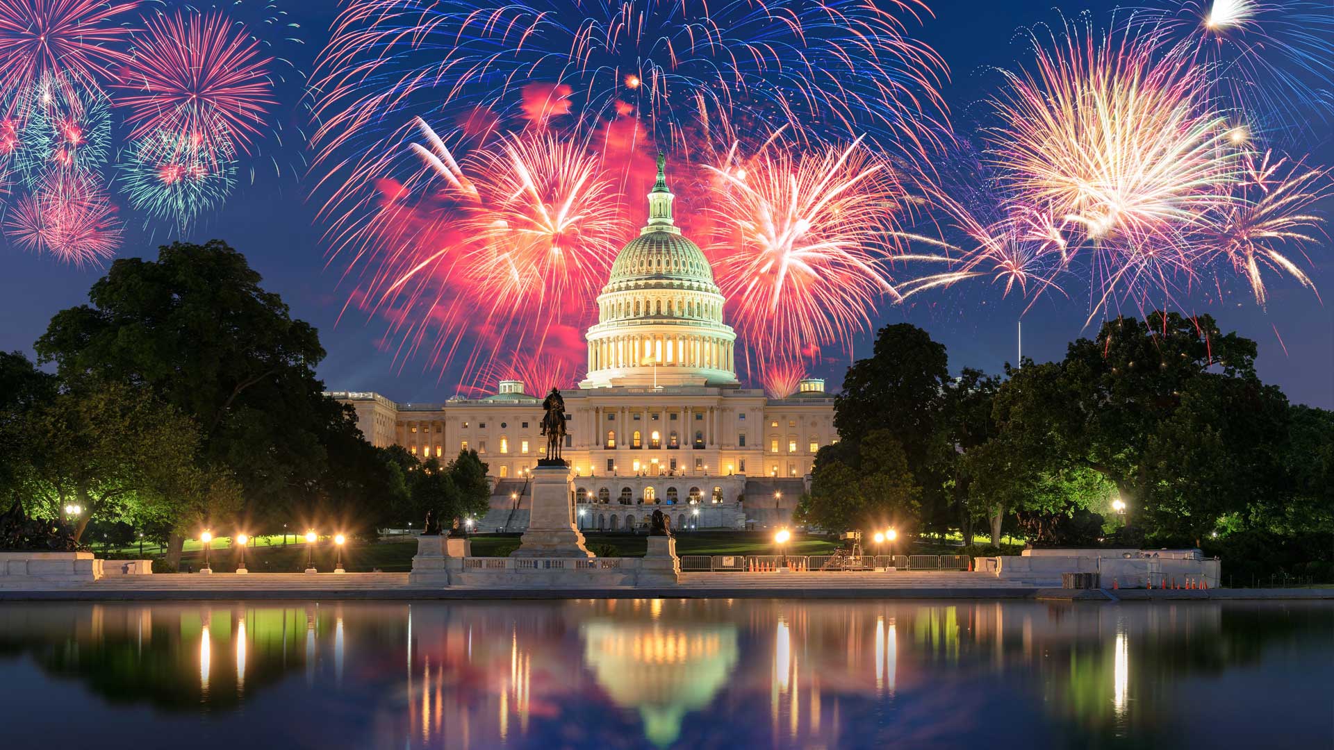 Capitol Building with firework lighting in the sky during night time